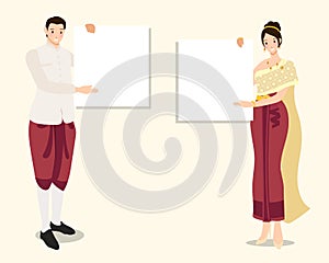 Thai traditional couple in red dress holding empty blank white board for text