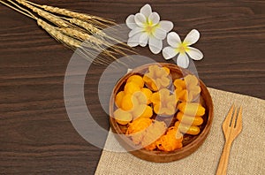 Thai traditional dessert concept, Thong Yip Thong Yod Foi Thong and jackfruit seeds in wood bowl
