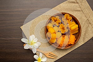 Thai traditional dessert concept, Thong Yip Thong Yod Foi Thong and jackfruit seeds in wood bowl