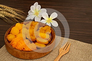 Thai traditional dessert concept, Thong Yip Thong Yod Foi Thong and jackfruit seeds in wood bowl