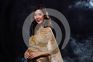 Thai Traditional Dress in dark backgrounds smoke