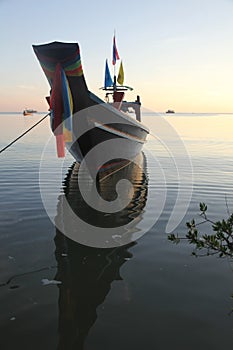 Thai traditional fishing boat moored close to the beach, Chalok Bann Kao, Koh Tao, Thailand