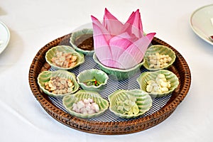 Thai traditional food, Asian raw healthy appetizer, Miang Kham lotus petals-wrapped. photo