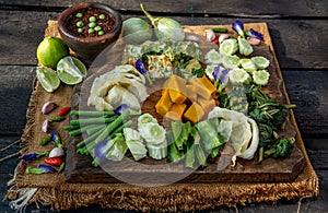 Thai Traditional Food : Spicy Shrimp Paste Dip or Fried shrimp paste sauce Nam Prik Kapi with blanched vegetables and cha-om