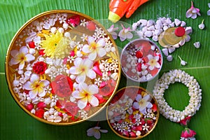 Thai traditional jasmine garland and Colorful flower in water bo