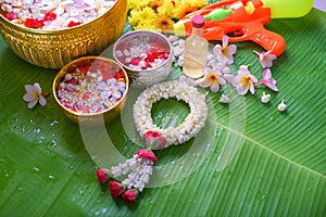 Thai traditional jasmine garland and Colorful flower in water bo