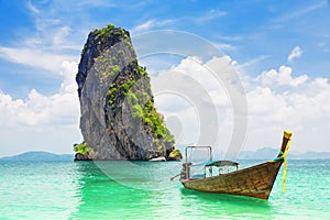 Thai traditional longtail boat and beautiful sand beach