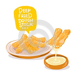 Thai traditional snacks deep-fried dough stick dipped in sweetened condensed milk.