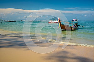 Thai traditional wooden longtail boat and beautiful sand Railay Beach in Ao nang,Krabi,Thailand