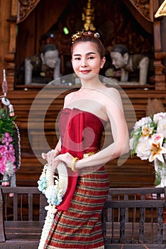 Thai woman dressed in traditional Northern Thailand culture costume