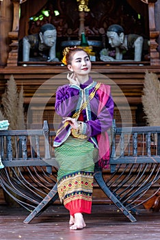 Thai woman dressed in traditional Northern Thailand culture costume