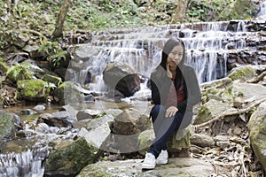 Thai woman with Mae Kam Pong waterfall, Chiangmai Thailand