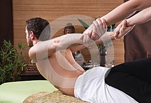 Thai woman making massage to a man