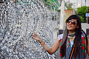 Thai woman portrait with Barbed wire for Defence