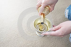 Thai woman`s hand pouring devoted to the deceased.