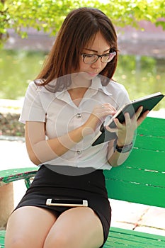 Thai woman student university beautiful girl using her tablet.