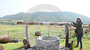 Thai woman with water-well at Viewpoint in winter season at Ban Kha