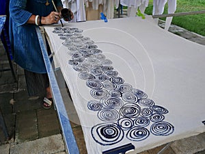 Thai women create and making batik tie dye process paint and drawing