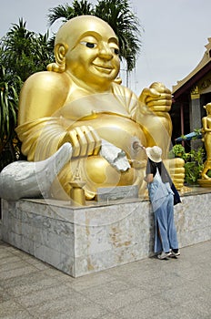 Thai women people visit and respect praying Wat Sakae Krang at Uthai Thani, Thailand