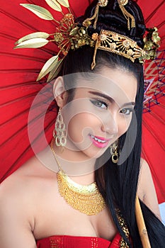 Thai women with red umbrella