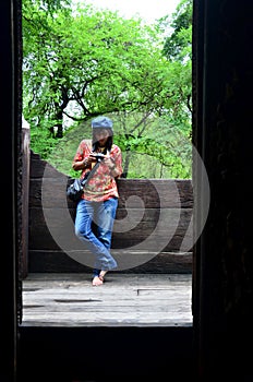 Thai women shooting photo at Shwenandaw Monastery