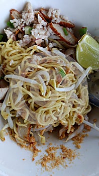 Thai yellow noodles with pork and fish ball menu