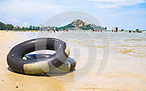 Thailand beach travle background concept - Life Ring on the beach, Life Ring on the sand at Huahin Thailand photo