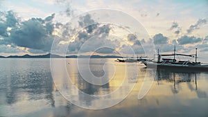 Thailand boat summer sunset dramatic landscape. Clouds reflection in blue calm sea water. Nature