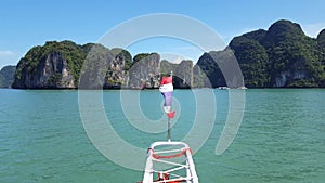 Thailand flag on a boat in the beautiful green waters