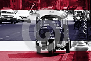 Thailand flag overlay on Tuk Tuk picture, it is a three-wheeled motorized vehicle used as a taxi are waiting and find for