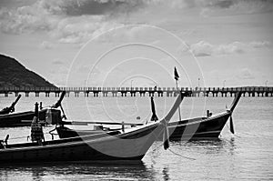 Thailand longtail fishing boat at Chalong bay. Phuket. Black and white