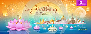 Thailand loy krathong festival banners on river at night photo