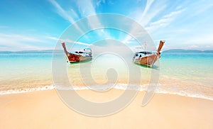 Thailand nature landscape. Sandy beach and travel boats on coast