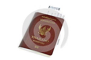 Thailand passport with air ticket in the middle