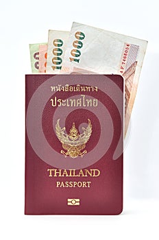 Thailand passport with banknotes