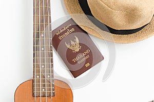 Thailand Passport , brown hat and Ukulele