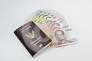 Thailand passport with Thai money ready to travel