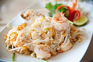 Stir-fried rice noodles with egg, vegetable and shrimp (Pad Thai)