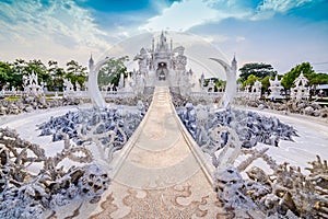 Thailand temple or grand white church Call Wat Rong Khun,at Chiang Rai province, Thailand,Contemporary unconventional Buddhist te photo