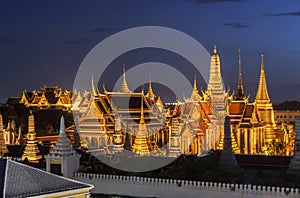 Thailand temple travel Grand palace Emerald Buddha Wat Phra Kaew at twilight Blue Sky from traffic in Bangkok, Thailand