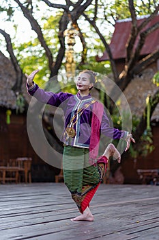 Thailand traditional or cultural dance in Thai costume. Young beautiful woman dressed in beautiful costumes, posing Thai Dancing