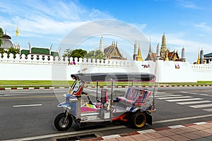 Thailand Tuk Tuk at Grand Palace with blue sky