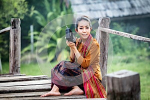 Thailand young beautiful woman listen to transistor radio