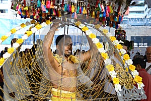 Thaipusam is a Hindu festival where devotees come together for a procession, carrying signs of their devotion and gratitude