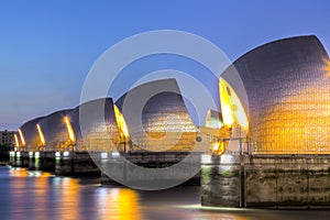Thames Barrier And Canary Wharf, London UK photo