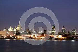 Thames river city of london skyline at night uk