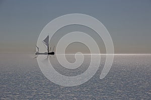 A Thames sailing barge on the horizon