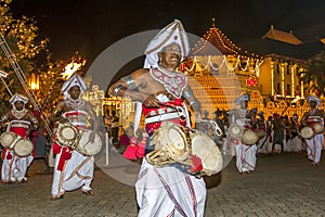 Thammattam Players perform at the Esala Perahera in Kandy, Sri Lanka.