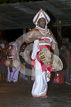 Thammattam Players perform at the Esala Perahera in Kandy, Sri Lanka.