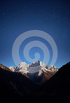 Thamserku mountain night view in the light of the rising Moon.